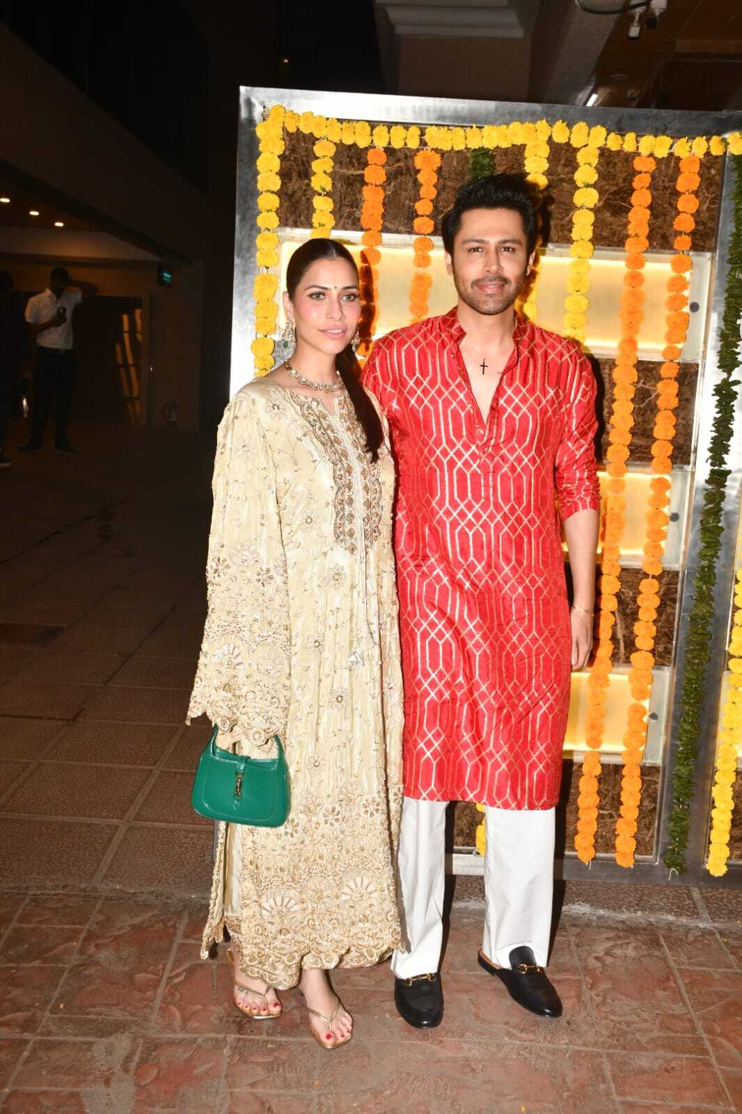 Popular actor Ssudeep Sahir was seen arriving with his wife at the festivities. The actor looked dapper in red kurta which he paired with white bottoms.